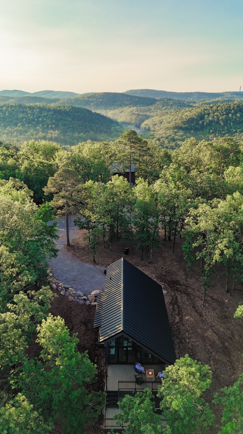 Aerial view of the A-frame cabin in the trees