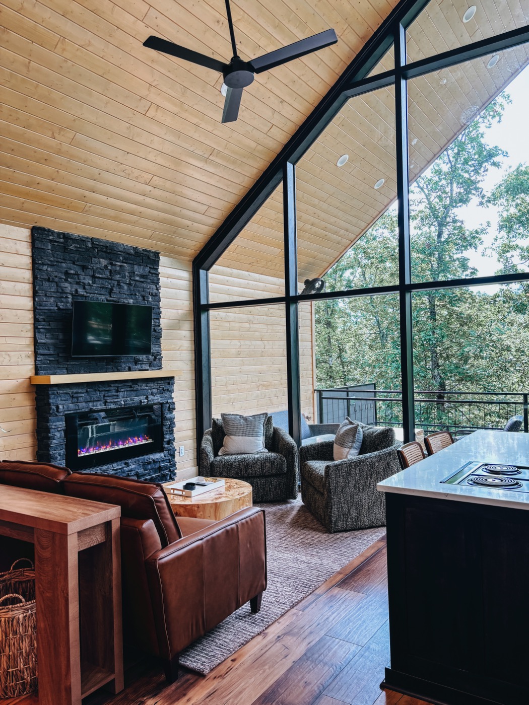 Cabin living room with stone fireplace